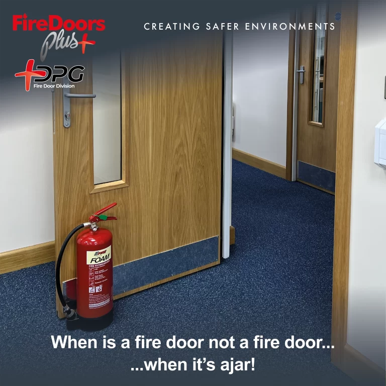 Fire door held open by fire extinguisher